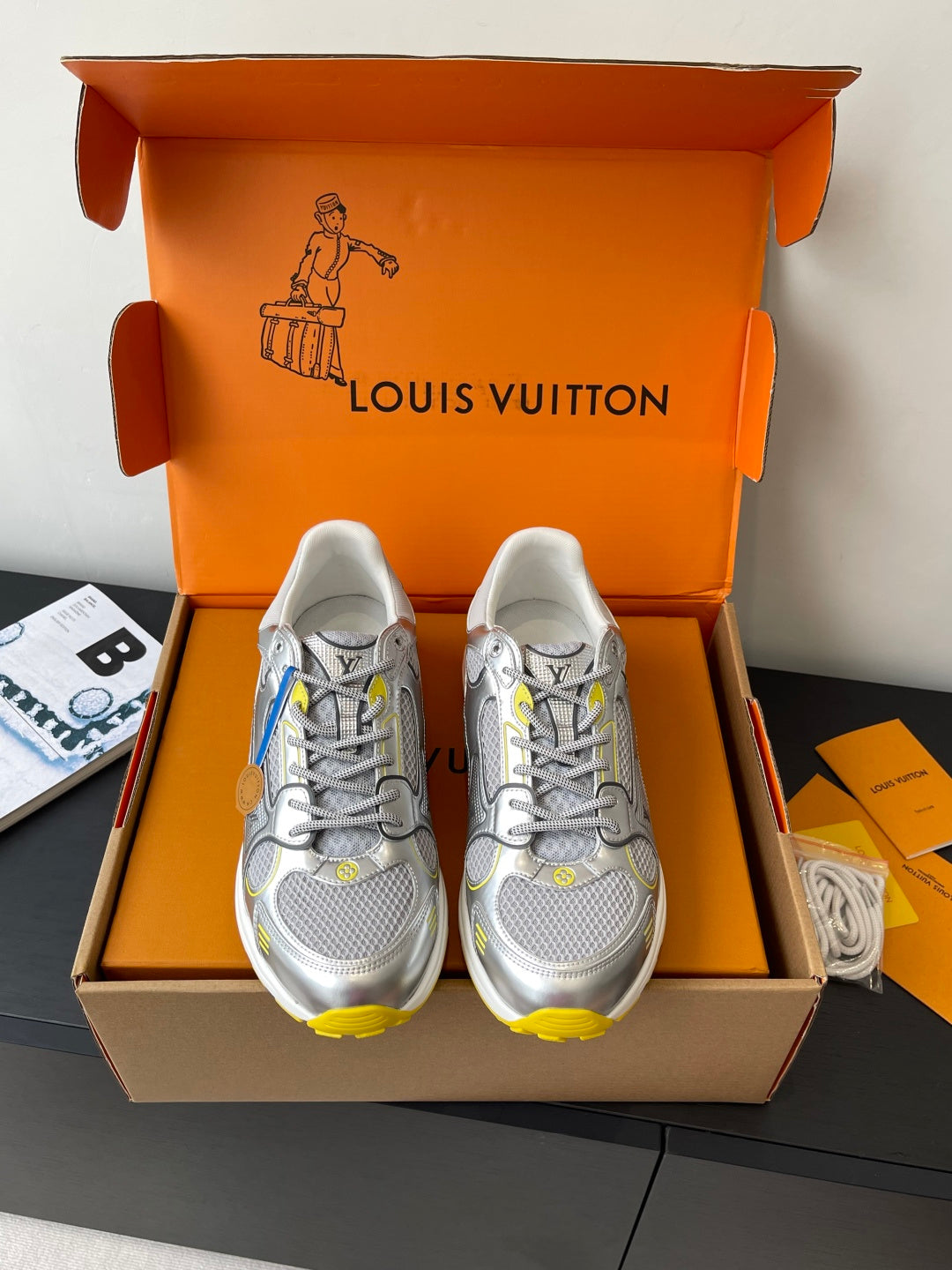 Silver Louis Vuitton sneakers for women with gray mesh and yellow accents, in box