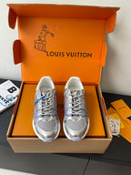Ladies' luxury sneakers in light gray with lace-up front, inside box display