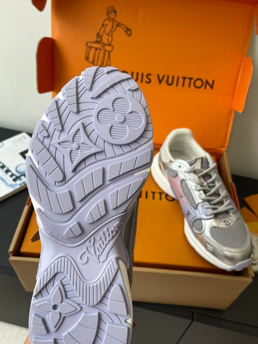 Ladies' luxury sneakers showing textured outsole and logo detailing, side and back