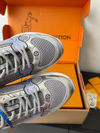 Ladies' luxury sneakers close-up of treaded outsole and lace-up sneaker upper