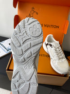White sneaker soles and tread pattern shown, with second shoe in orange box behind.