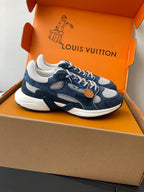 Navy and white lace-up sneakers with textured panels and tan logo patch