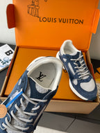 Navy and white ladies' sneakers with lace-up closure and stitched logo detail