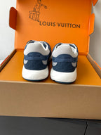Back view of navy-and-white lace-up sneakers with cushioned heel and trim