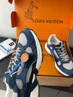 Navy and white lace-up sneakers with round tan emblem and white rubber sole