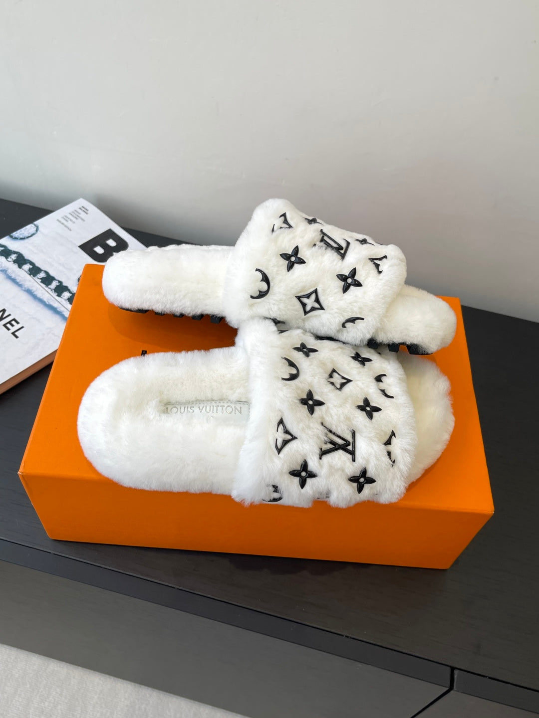 Louis Vuitton women’s plush slides, white faux-fur straps with LV monogram print