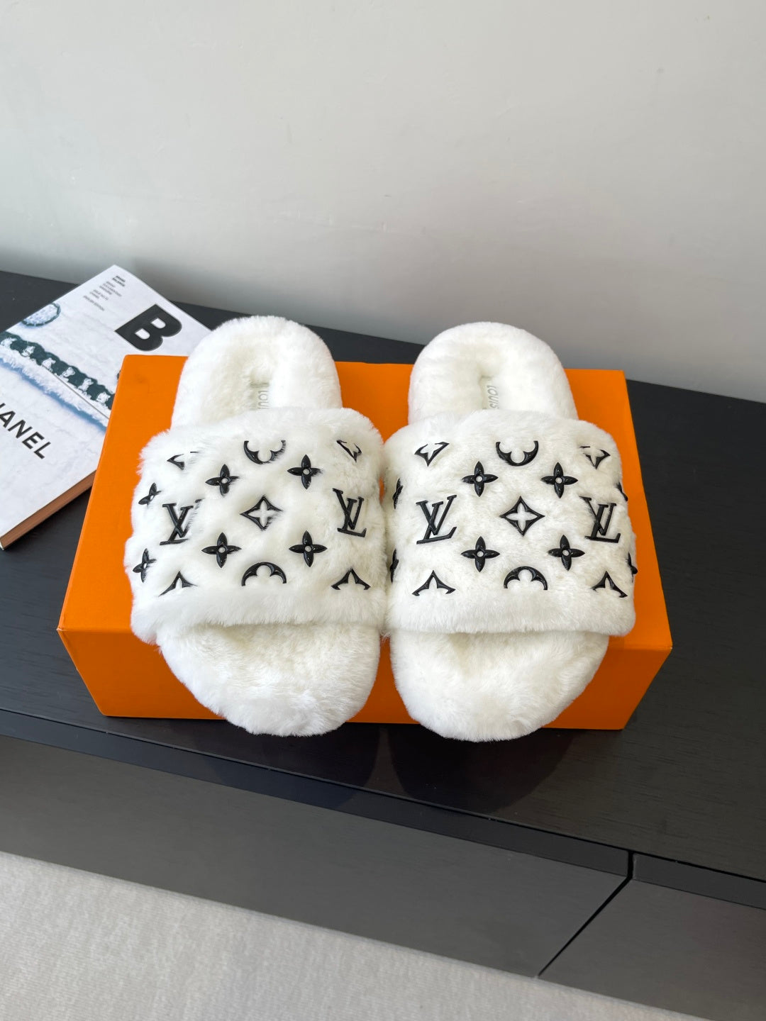 Louis Vuitton women’s plush slides with LV monogram, white faux-fur straps