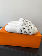 Louis Vuitton women’s plush slide sandals with LV monogram, white fuzzy upper