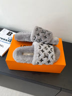Louis Vuitton plush slippers with gray fur, black monogram strap and padded footbed