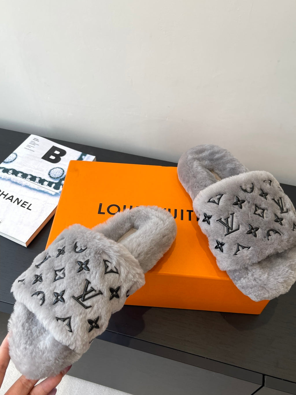 Louis Vuitton plush slippers with gray lining and black monogram toe straps