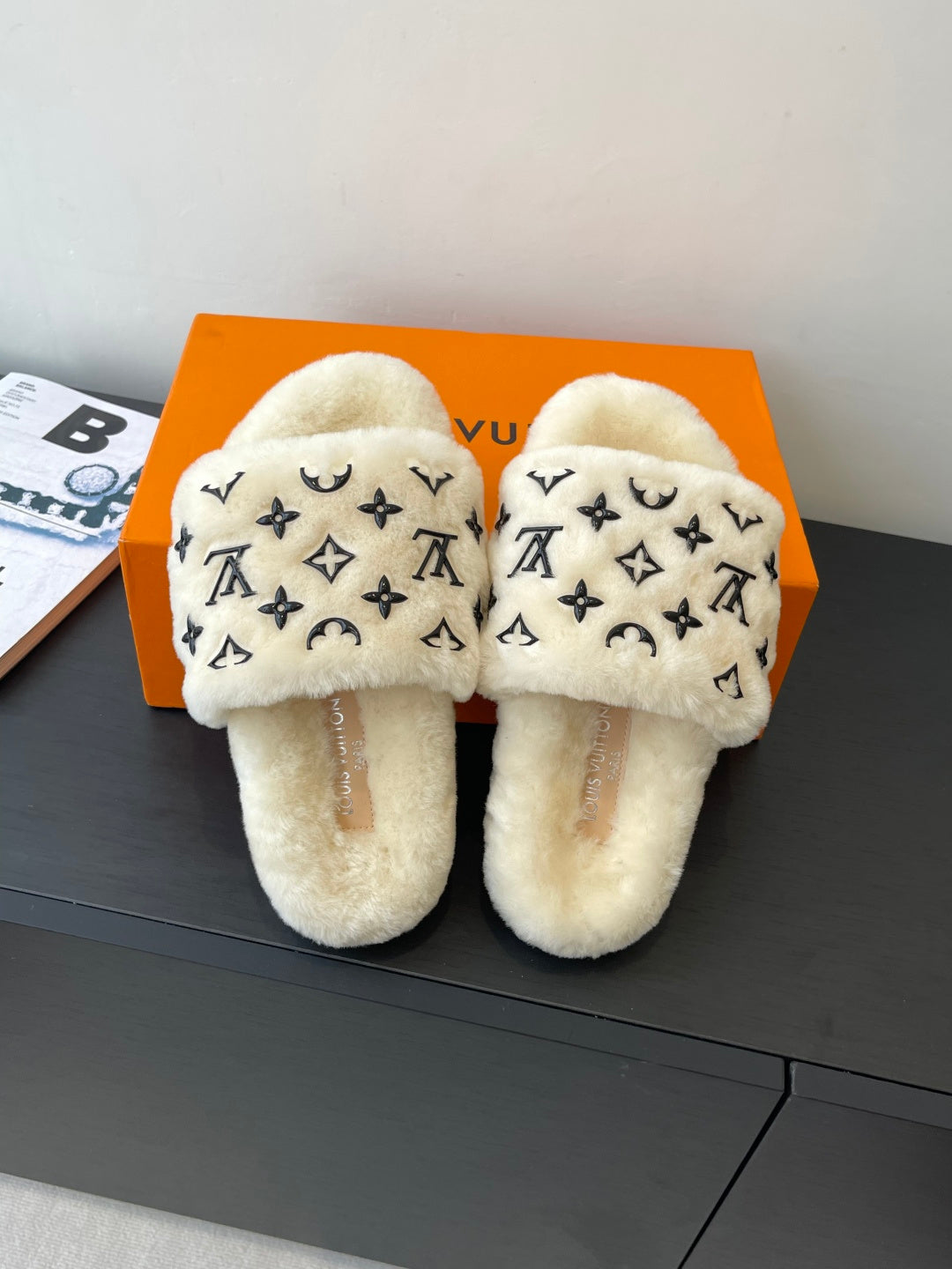 Louis Vuitton plush fur slides, cream with black monogram pattern and slip-on straps