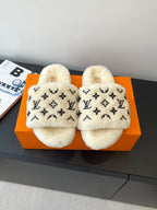 Louis Vuitton plush fur slides with black monogram pattern on cream upper