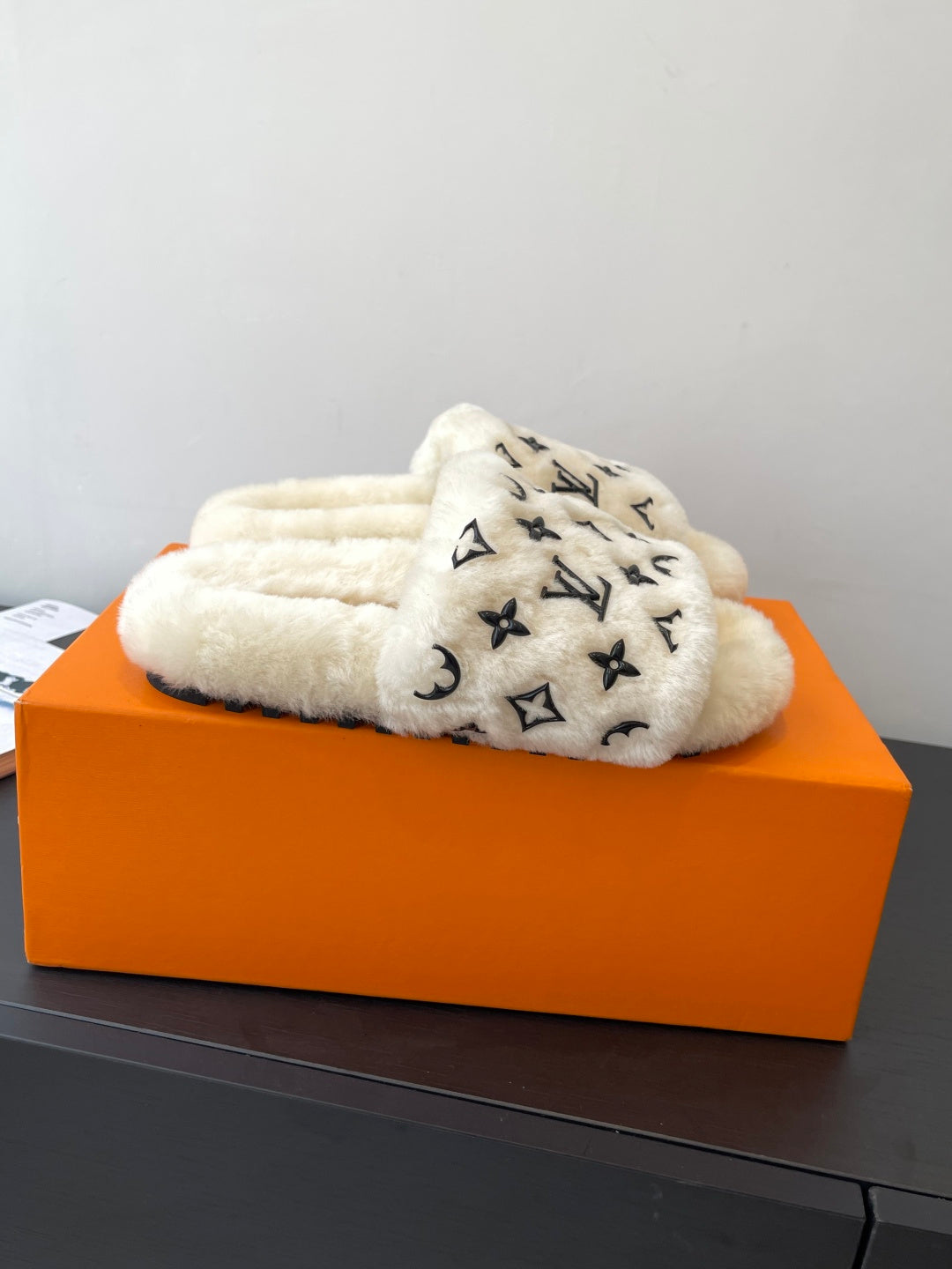 Louis Vuitton plush fur slide sandals, cream with black monogram allover print