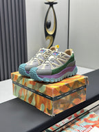 Moncler lace-up trail sneakers with beige mesh, green and purple panels, blue lug sole