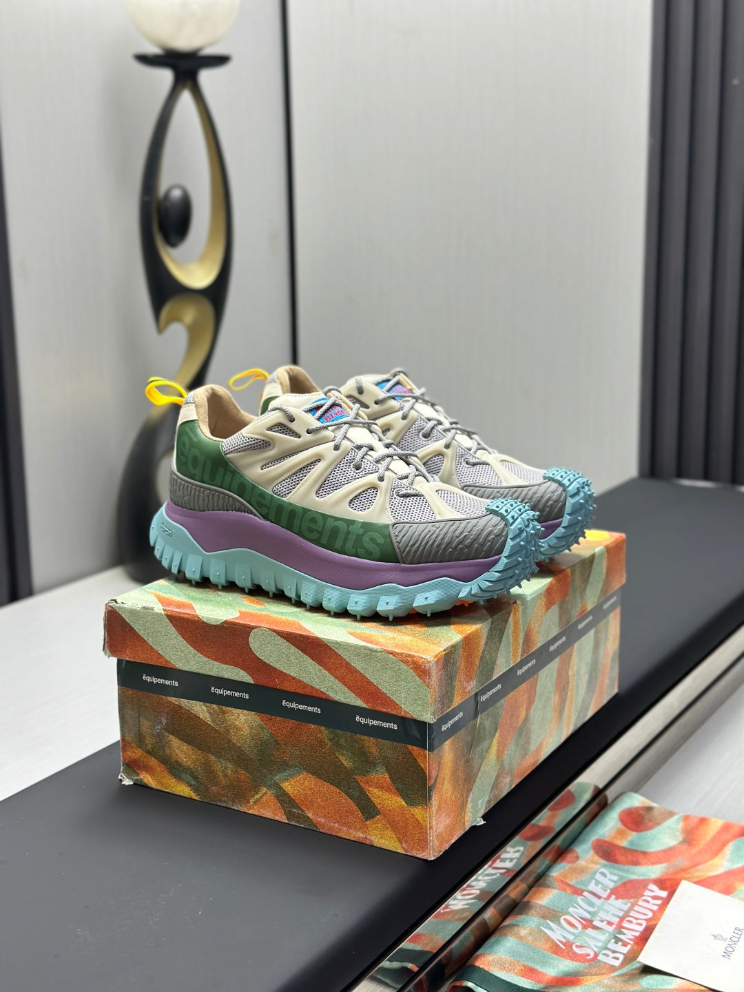 Moncler lace-up trail sneakers, beige upper with green collar, purple side, blue tread sole