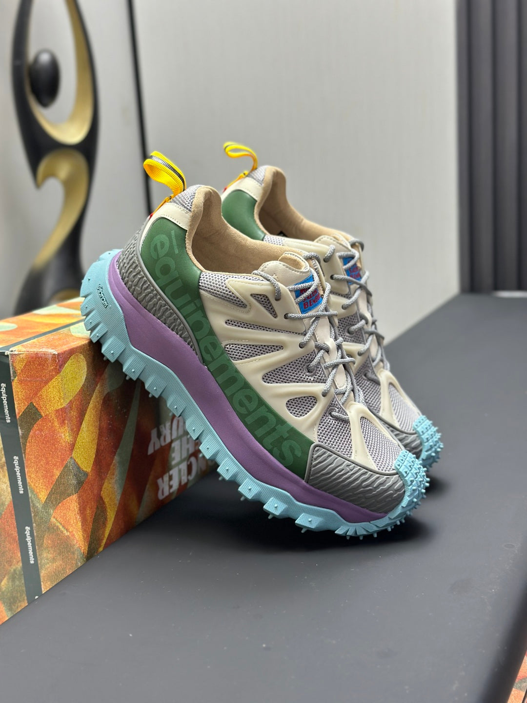 Moncler lace-up trail sneaker, beige mesh with green collar and purple trim, blue tread sole
