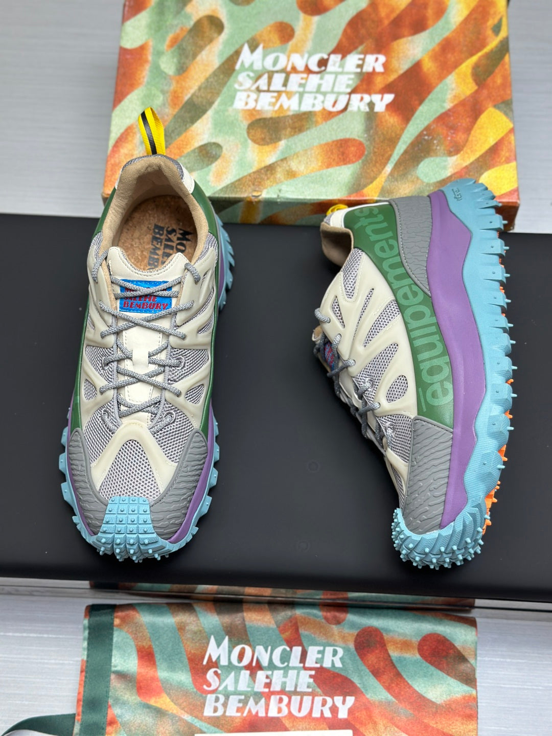 Moncler lace-up trail sneakers, beige mesh with green and purple sides, blue lug outsole