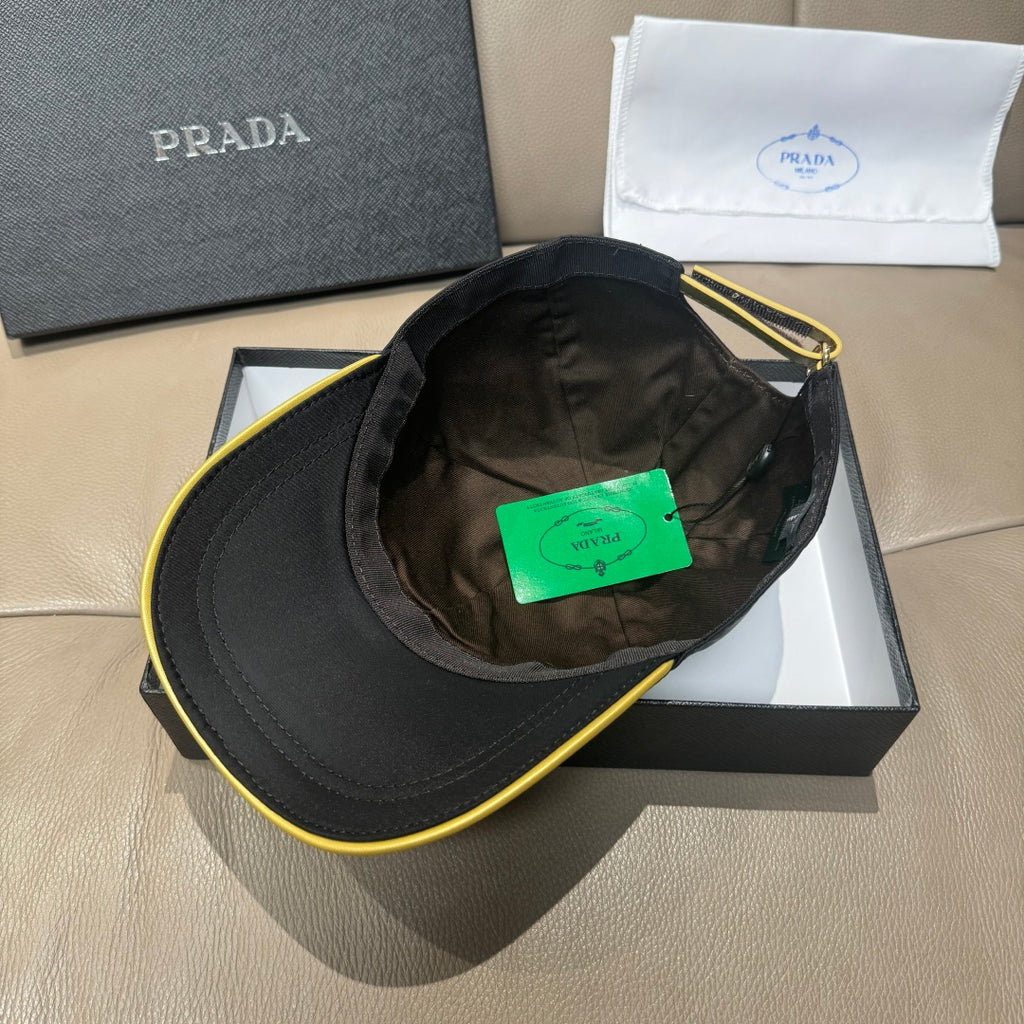Black Prada cap interior view with green tag in crown