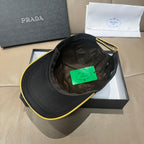 Black Prada cap interior view with green tag in crown
