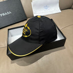 Black Prada cap angled view with embroidered yellow logo and contrast yellow edge