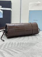 Prada brown leather wristlet/clutch with gathered top and gold zipper trim