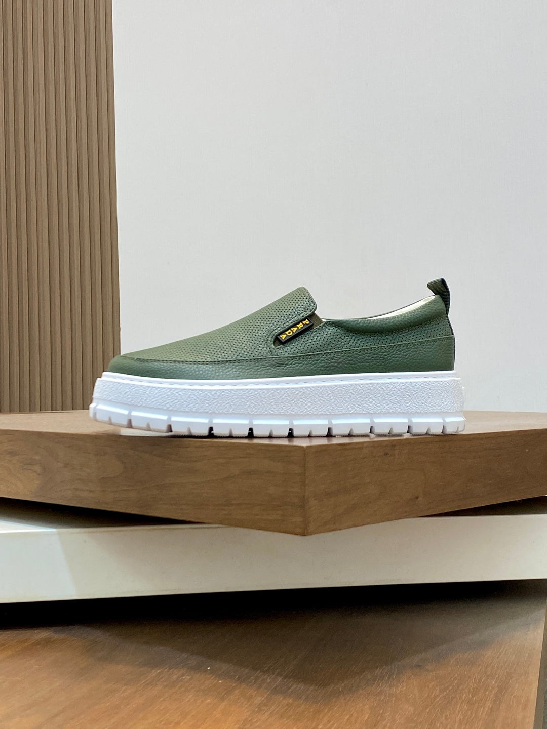 Prada unisex slip-on shoes, green knit upper with white sole and side logo tab