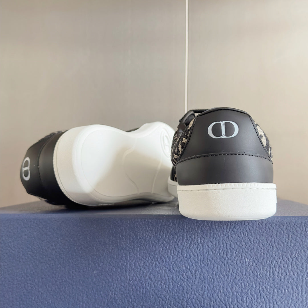 Low-top sneakers heels, dark gray and Dior monogram uppers with white midsole, black laces.