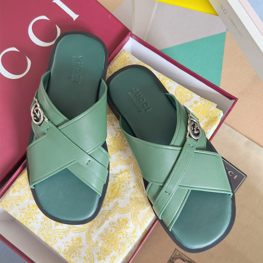 Gucci green leather sandals with X-strap and silver logo buckle, cushioned footbed