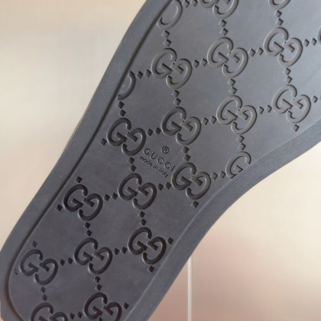 Gucci embossed rubber sandal outsole with raised logo pattern