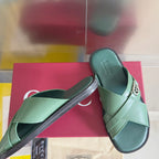Gucci green leather sandals with wide cross strap and silver logo buckle detail