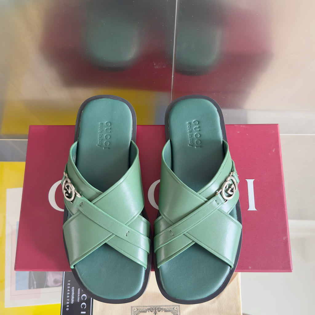 Gucci green sandals with two straps and silver logo buckle, pair view