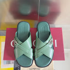 Gucci green sandals with two straps and silver logo buckle, pair view