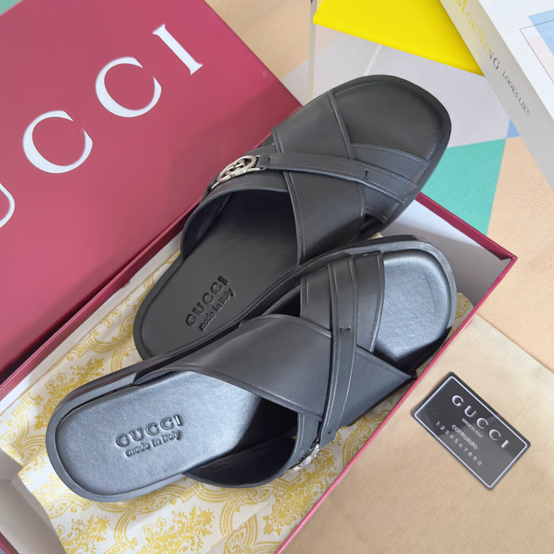 Gucci black leather sandals with crossover straps and silver G buckle, pair view