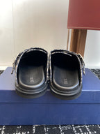 Dior slides viewed from back with black soles and footbed branding