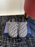 Dior sandals in blue-and-cream Oblique pattern with black leather straps