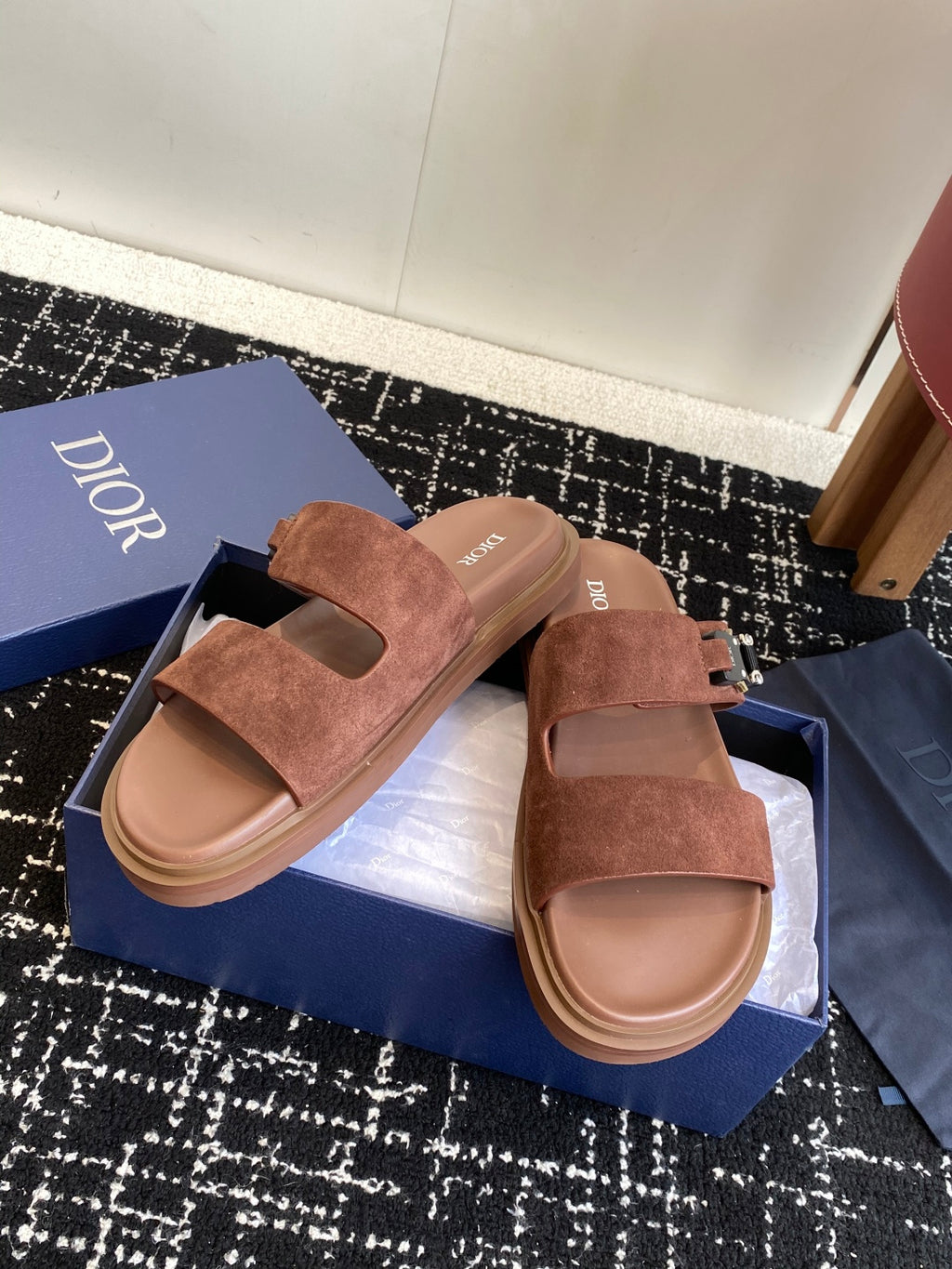 Dior slide sandals, brown suede two-strap style with metal buckles on box