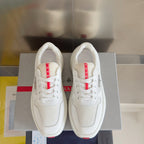 Prada unisex sneakers, pair view with white mesh uppers and red-and-white logo details