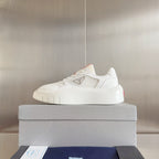 Prada unisex sneakers, front view on box; white platform sole and logo patch