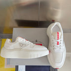Prada unisex sneakers on box, white mesh panels and padded tongue with logo tag