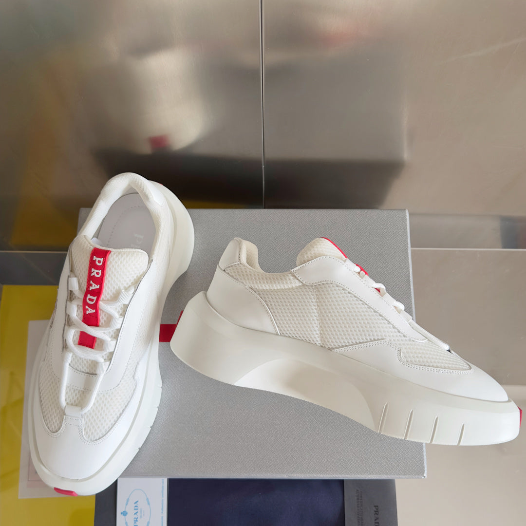 Prada white low-top sneakers with textured upper and padded collar