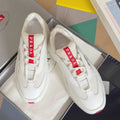 Prada unisex white sneakers with red logo tongue and textured uppers