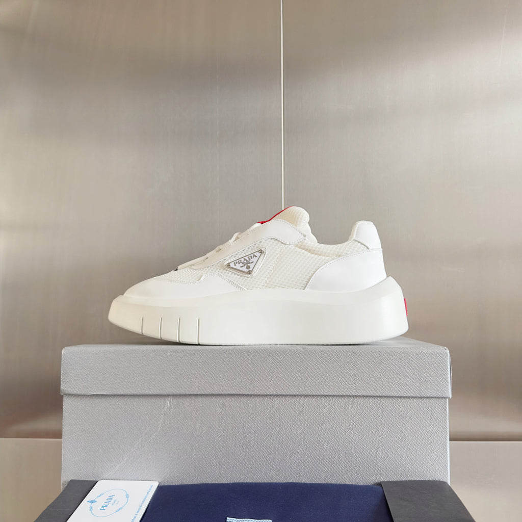 Prada white low-top sneakers with cushioned sole and logo badge on side