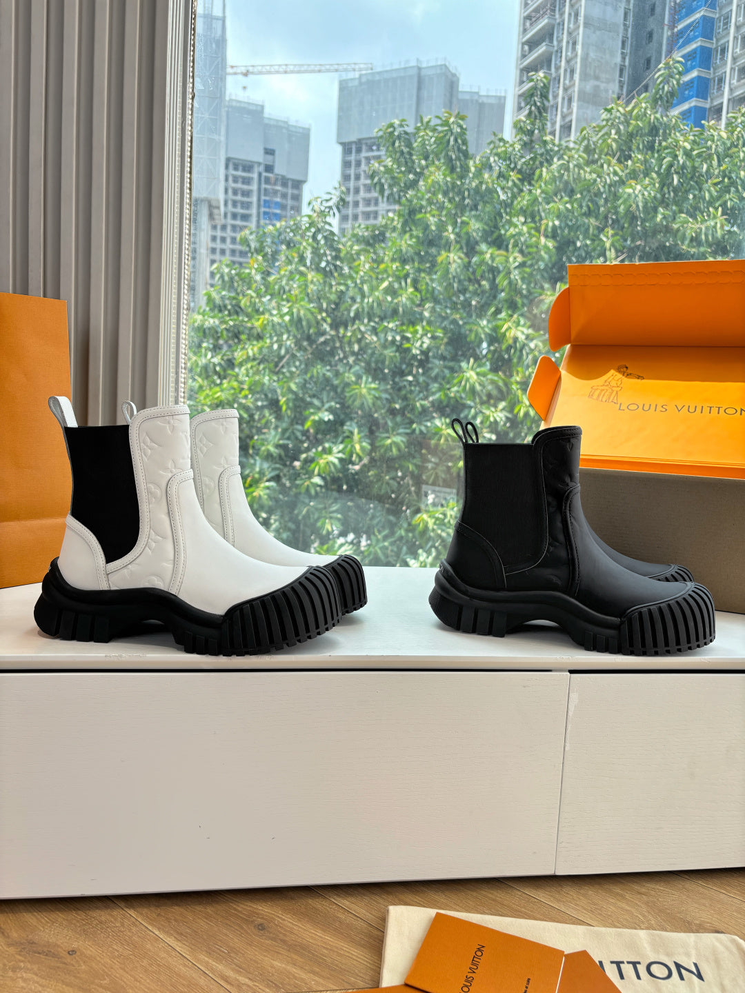 Unisex Chelsea boots, white and black with elastic side gores and chunky ribbed soles