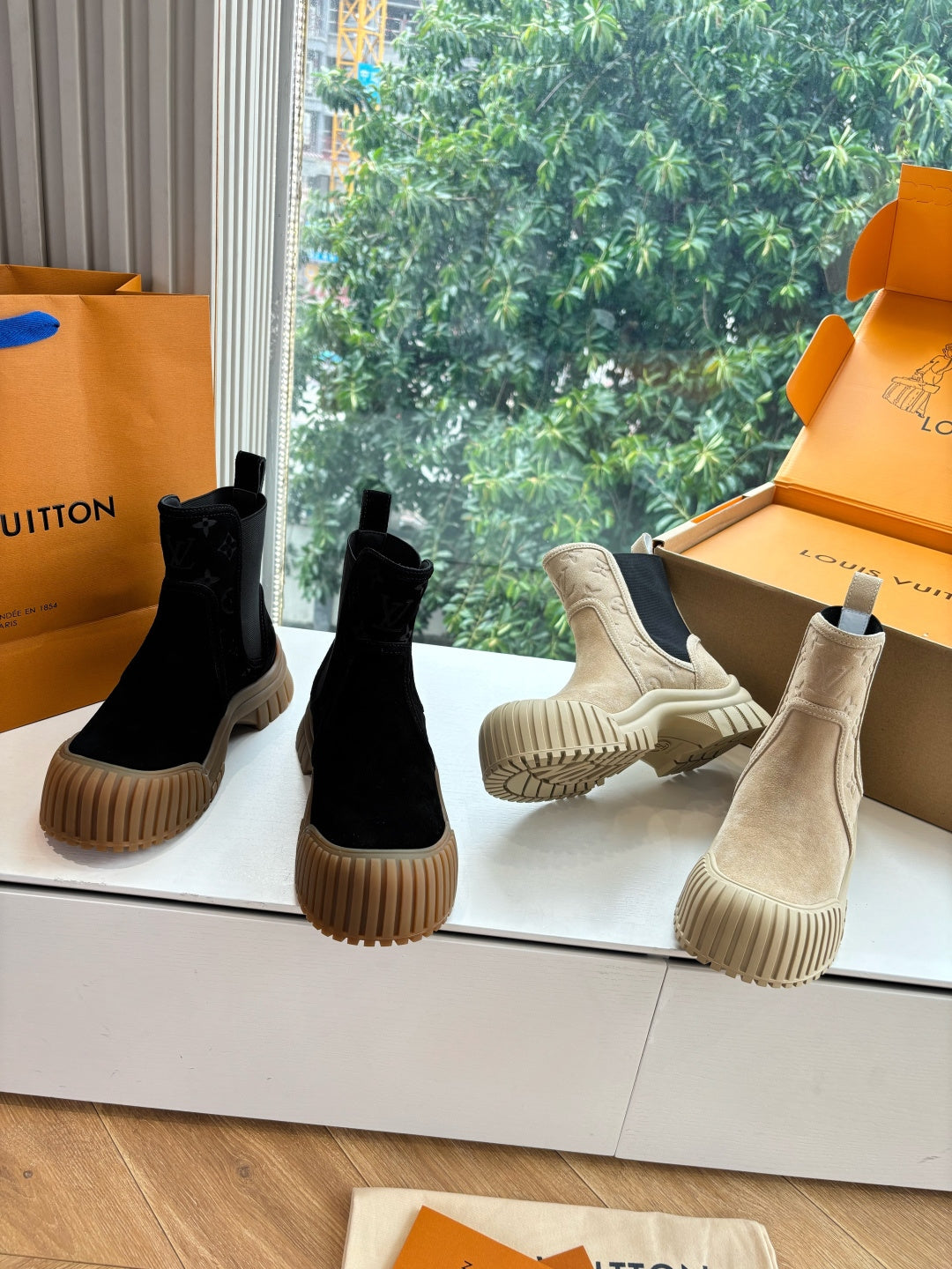 Unisex Chelsea boots, black and beige uppers with chunky rubber soles