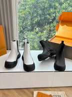 Unisex Chelsea boots, white and black suede-style uppers with ribbed chunky soles
