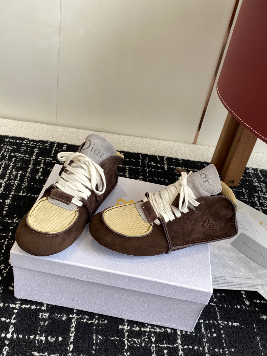 Dior unisex high-top sneakers on box, pair view, white laces and brown suede with tan mesh