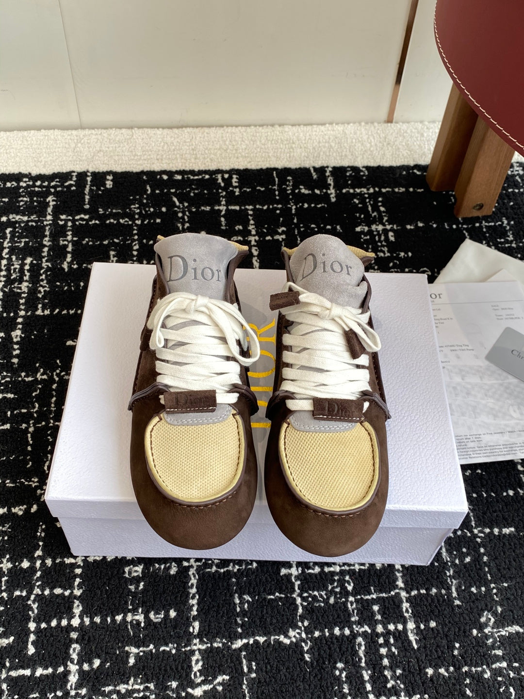 Dior unisex high-top sneakers with white laces, brown suede, and tan mesh panels