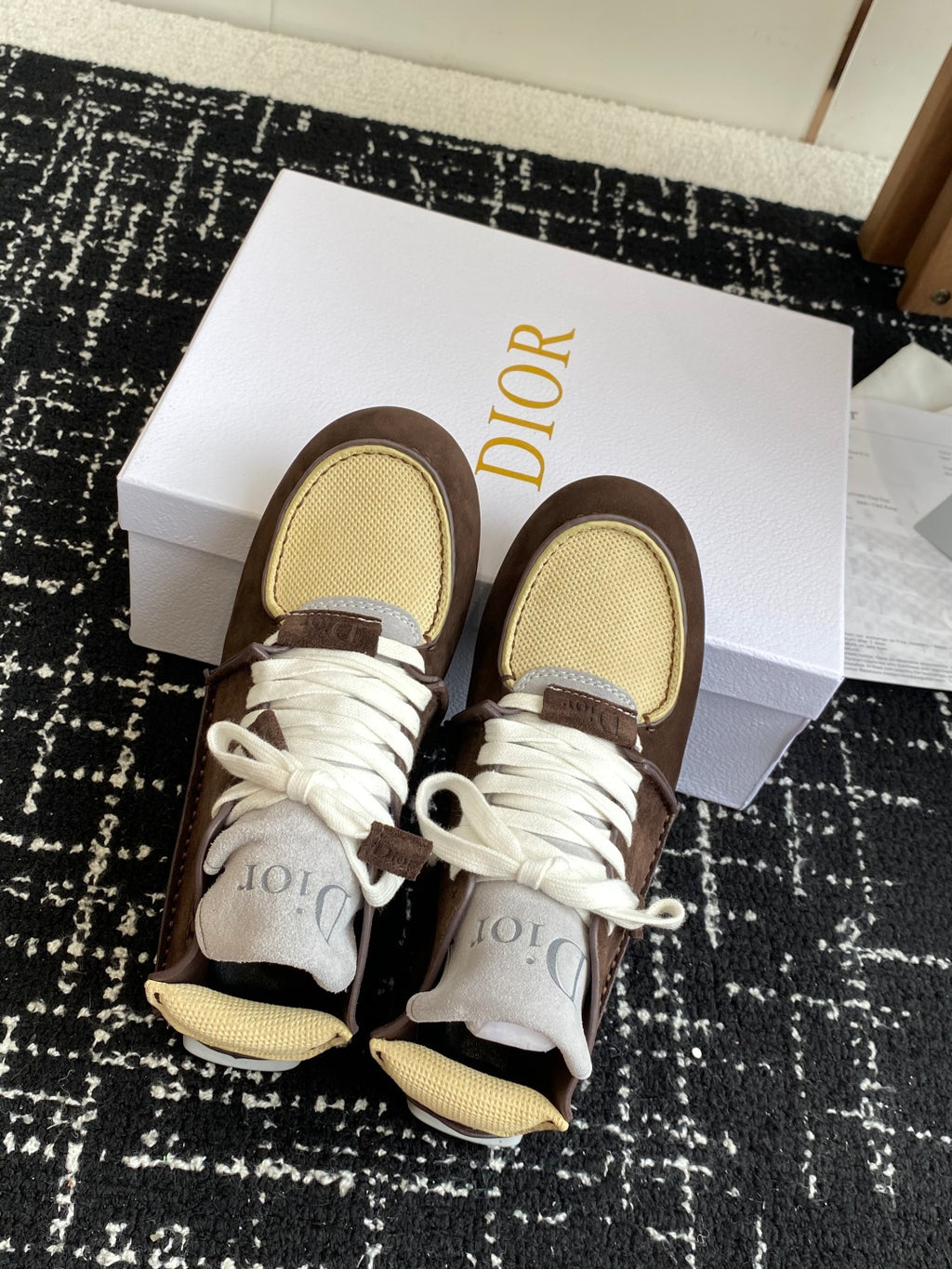 Dior unisex high-top sneakers, top view, brown suede with white laces and tan mesh panels