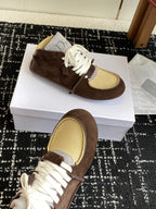 Dior unisex high-top sneakers, close-up angle, brown suede with white laces and tan mesh