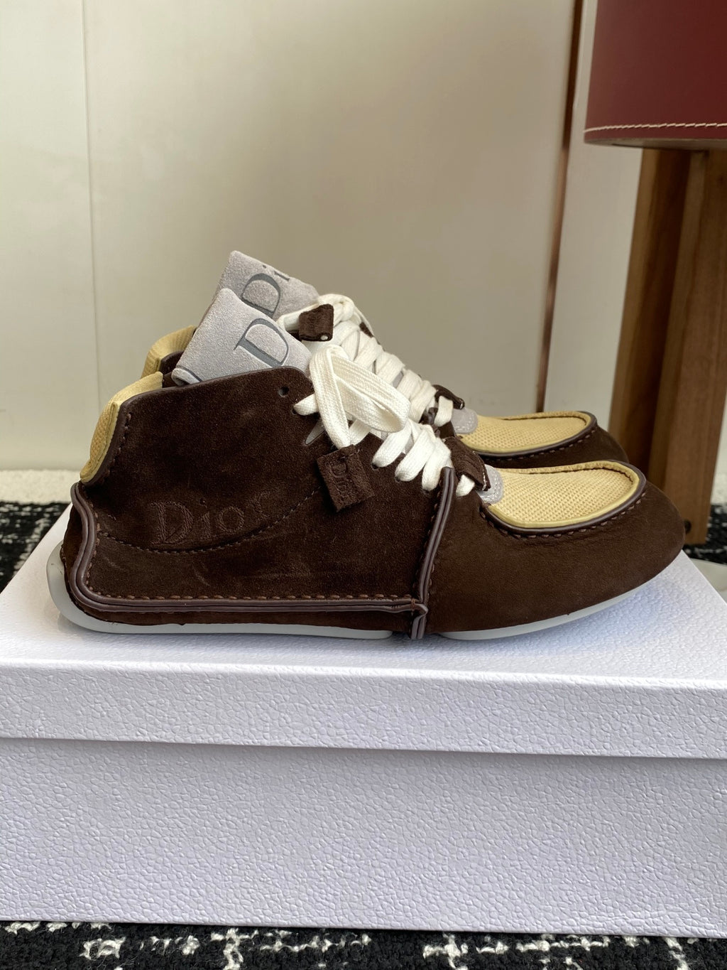 Dior unisex high-top sneakers, side view, white laces over brown suede and tan trim